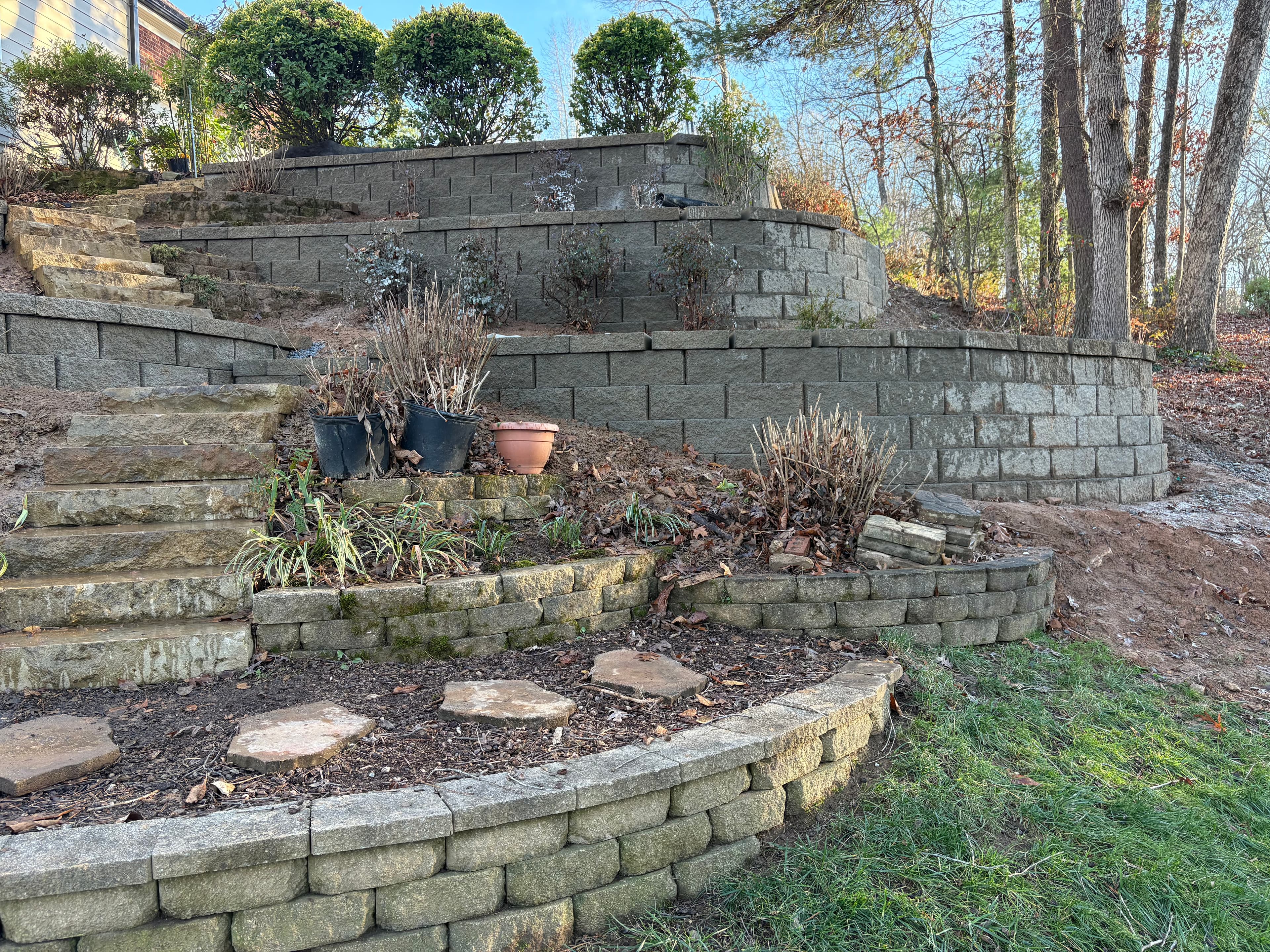 Terraced hillside retaining walls with planting beds